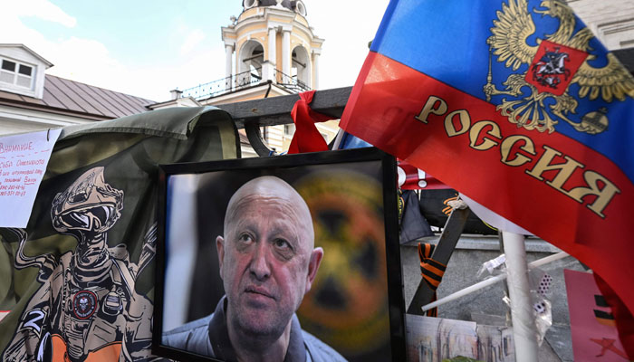 This photograph shows a portrait of the late head of the Wagner Yevgeny Prigozhin displayed at a makeshift memorial in Moscow on August 27, 2023. — AFP