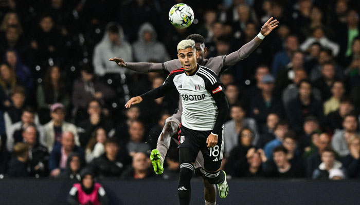 Tottenham Hotspur´s Brazilian defender #12 Emerson Royal (rear) fights for the ball with Fulham´s Brazilian midfielder #18 Andreas Pereira during the English League Cup football match between Fulham and Tottenham Hotspur at Craven Cottage stadium, in London, on August 29, 2023.