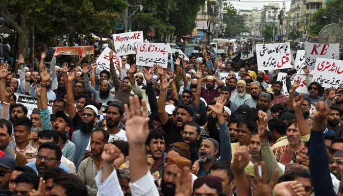 Traders shout slogans against the surge in petrol and electricity prices during a protest at a street in Karachi on August 23, 2023. — AFP/File