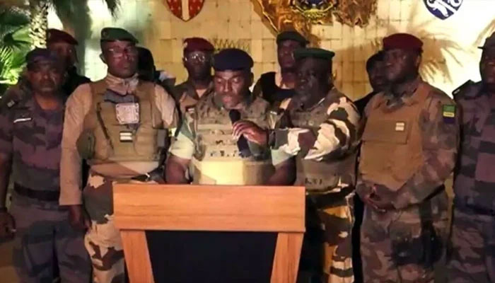 This video grab taken from Gabon 24 shows Gabonese soldiers appearing on television on 30 August 2023 announcing takeover of power from president Ali Bongo. — AFP