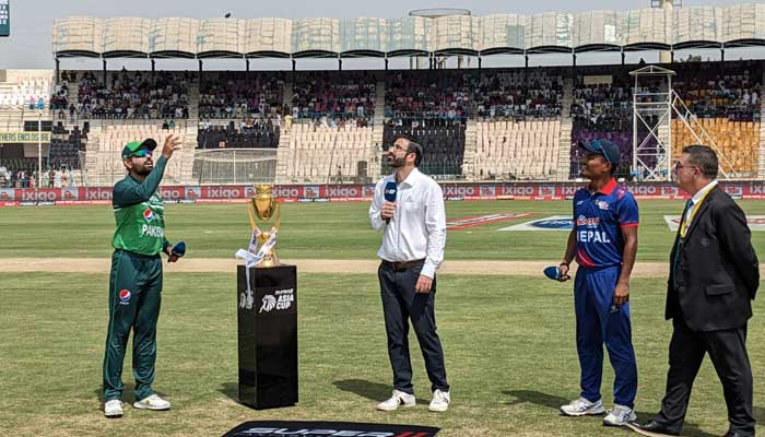 Pakistan skipper Babar Azam flips the coin at the toss against Nepal at Multan Cricket Stadium on August 30, 2023. — Twitter/@TheRealPCB