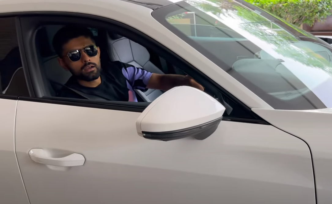 Pakistan skipper Babar Azam sitting in his new car in this screengrab taken from a video. — YouTube/