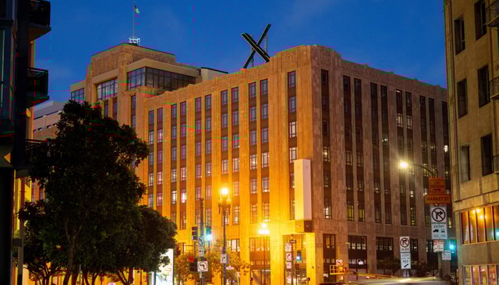 X sign is seen on the roof of the headquarters of the social media platform previously known as Twitter, in San Francisco, on July 29, 2023. — AFP