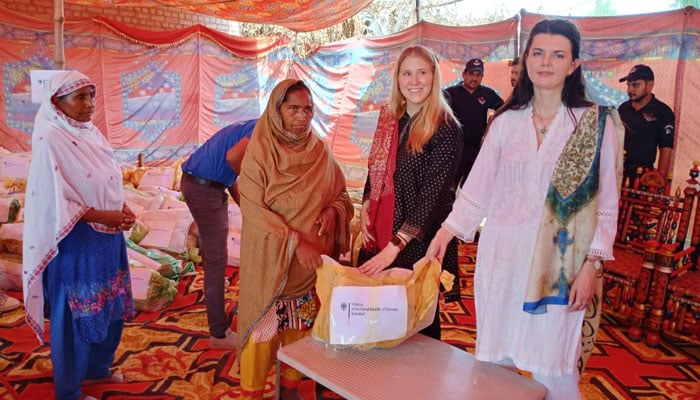 Head of Communications and Cultural Affairs Dorota Berezicki and Human Rights Counsellor Julia Klein with members of the Christian community that were affected by the violence in Jaranwala. — PR