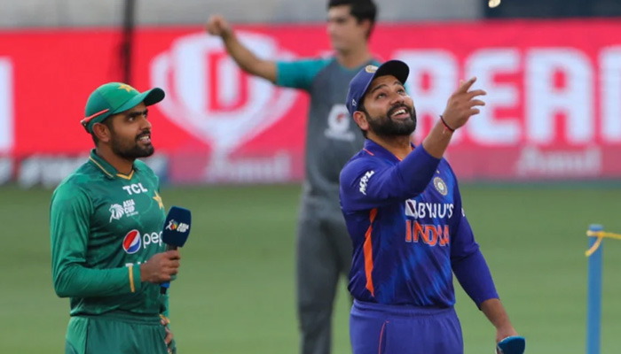 Pakistan captain Babar Azam (left) and India skipper Rohit Sharma react during toss in an Asia Cup match in 2022. — ICC