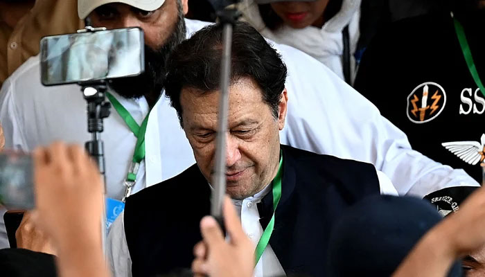 PTI Chairman Imran Khan leaves after appearing in the Supreme Court in Islamabad on July 26, 2023. — AFP