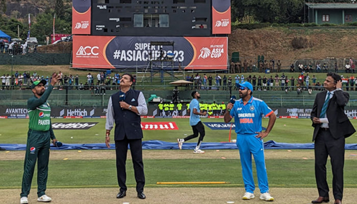 Babar Azam (Left) tosses the coin ahead of the match today. — PCB