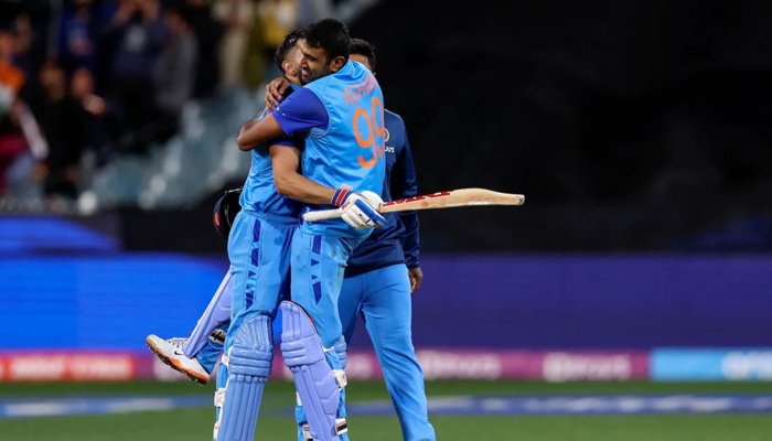 Ashwin hugs Virat Kohli after hitting the winning run off the final ball in the nerve-wracking game on October 23, 2022. — AFP