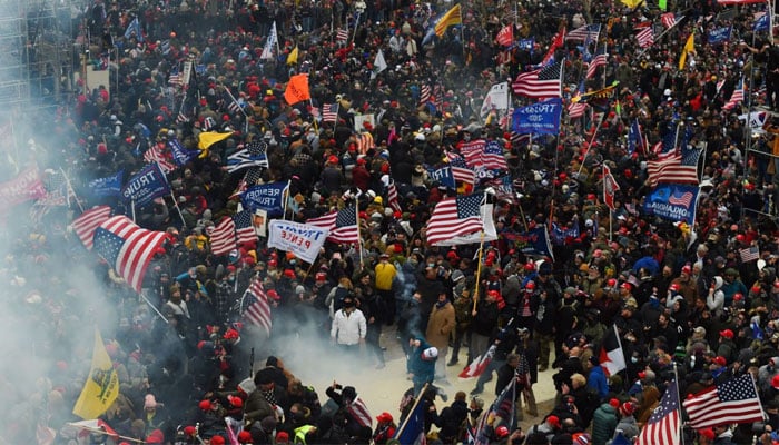TOPSHOT - Trump supporters clash with police and security forces as they storm the US Capitol in Washington DC on January 6, 2021.—AFP/file