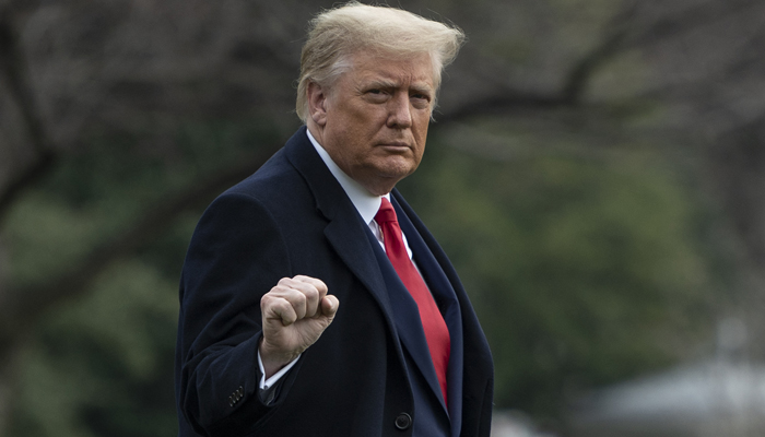US President Donald Trump departs the White House in Washington, DC, on December 12, 2020. — AFP