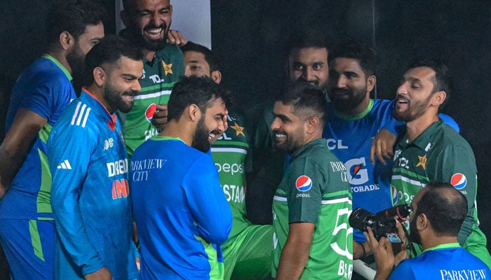 India´s Virat Kohli (2L) talks with Pakistan´s players at the end of the Asia Cup 2023 one-day international (ODI) cricket match between India and Pakistan at the Pallekele International Cricket Stadium in Kandy on September 2, 2023 — AFP