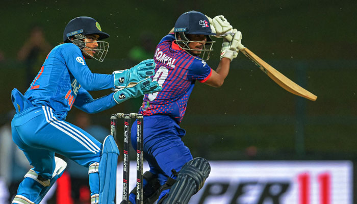 Nepal’s Sompal Kami (right) plays a shot during the Asia Cup 2023 one-day international (ODI) cricket match between India and Nepal at the Pallekele International Cricket Stadium in Kandy on September 4, 2023. — AFP