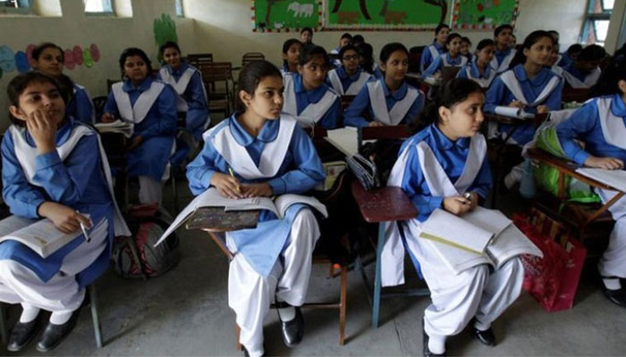 Students listen to their teacher during a lesson at a school in Pakistan. — Reuters/File