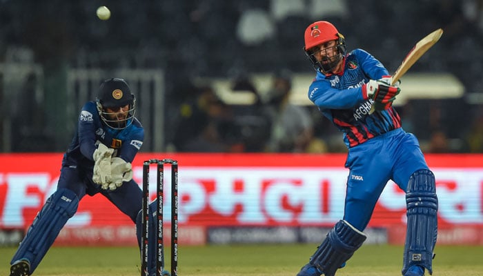Afghanistan’s Mohammad Nabi (right) plays a shot during the Asia Cup 2023 one-day international (ODI) cricket match between Sri Lanka and Afghanistan at the Gaddafi Stadium in Lahore on September 5, 2023. — AFP