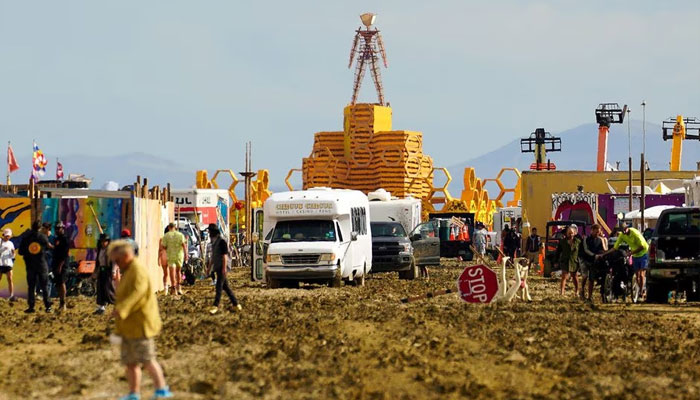 The Man structure, which is normally burned on Saturday night, looms over the Burning Man encampment in Black Rock City, Nevada, September 3.—Reuters