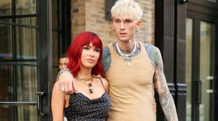 Megan Fox debuts flaming red hair on rare outing with Machine Gun Kelly 