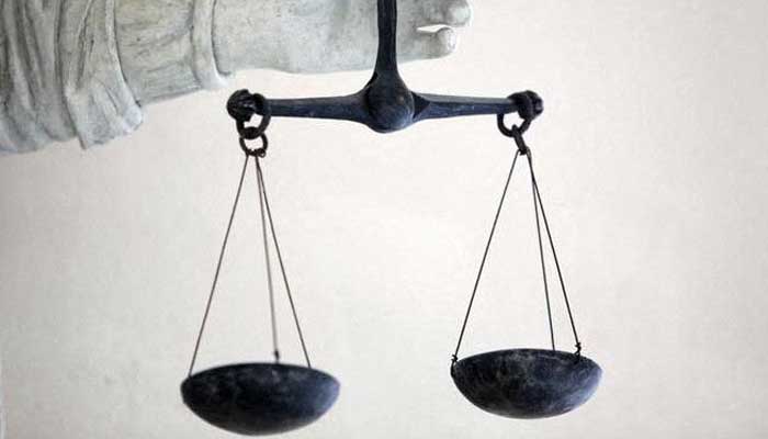 A representational image of scales of justice— Reuters