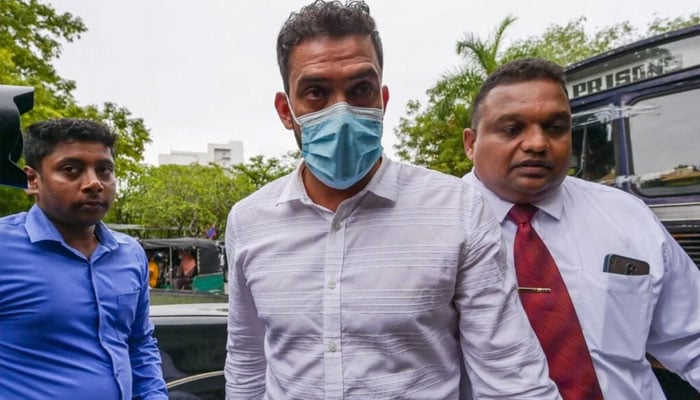 Sachithra Senanayake (centre) is the first cricket player to be prosecuted under a 2019 law that makes match-fixing a criminal offence. —AFP