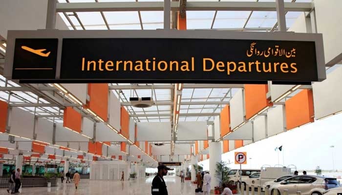 A worker walks at the departure area of the Islamabad International Airport, during a media tour. — Reuters/File