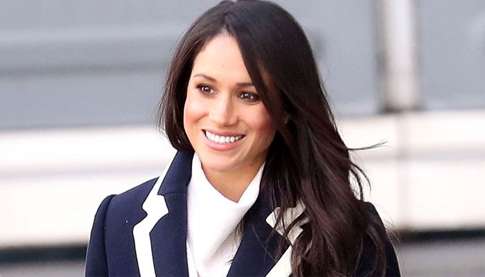 Meghan Markle’s serving up a ‘decidedly peppy and upbeat’ face