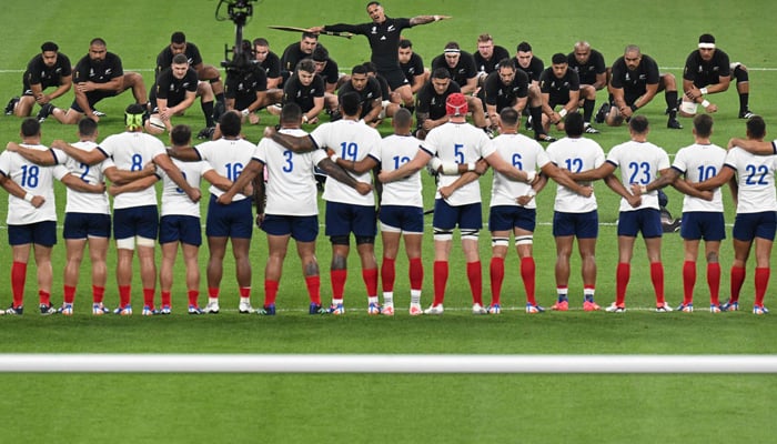 New Zealand players led by scrum-half Aaron Smith (C) perform the Haka prior to the France 2023 Rugby World Cup Pool A match between France and New Zealand at Stade de France in Saint-Denis, on the outskirts of Paris on September 8, 2023. — AFP
