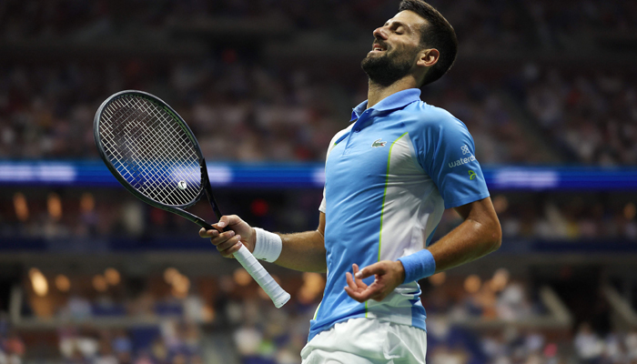 Novak Djokovic reacts after a point against Ben Shelton of the US during their Singles Semifinal match on Day Twelve of the 2023 US Open at the USTA Billie Jean King National Tennis Center on September 08, 2023. — AFP