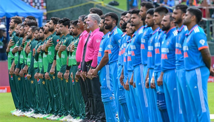 Pakistans (left) and Indias players stand for national anthems before the start of the Asia Cup 2023 ODI between India and Pakistan at the Pallekele International Cricket Stadium in Kandy on September 2, 2023. — AFP