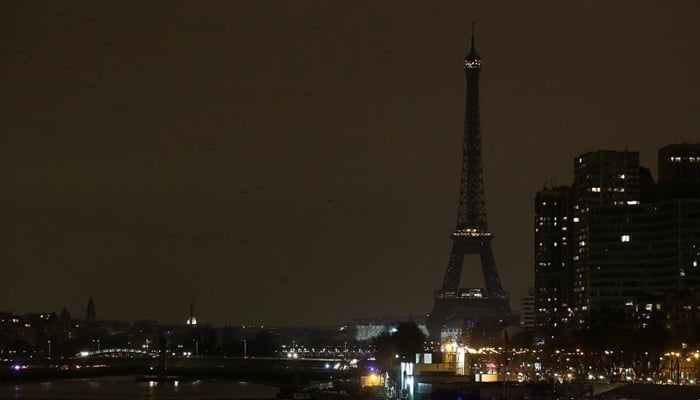 A picture shows the Eiffel Tower in Paris after it went dark for the Earth Hour environmental campaign on March 19, 2016. — AFP
