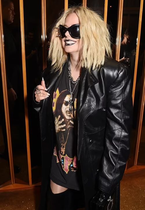 Avril Lavigne channels punkrock vibes with graphic tee at runway show afterparty