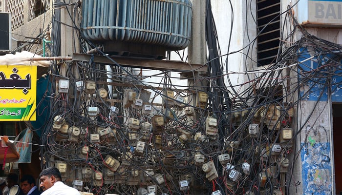 Several electricity meters are visible on a street in Faisalabad on September 25, 2022. — APP
