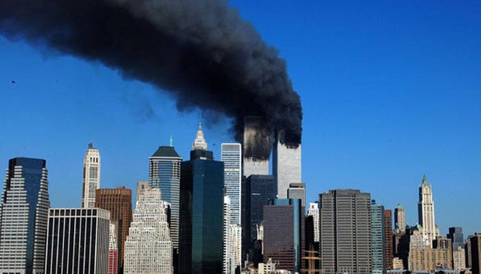 The twin towers of the World Trade Center billow smoke after hijacked airliners crashed into them early Sept. 11, 2001.—AFP