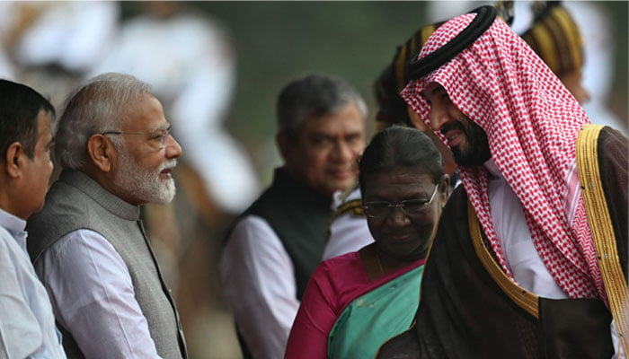 Indian President Droupadi Murmu (3R) looks on as India´s Prime Minister Narendra Modi (3L) and his Saudi Arabian counterpart and Crown Prince Mohammed bin Salman (2R) shake hands during a ceremonial reception at the President House a day after the G20 summit in New Delhi on September 11, 2023.—AFP