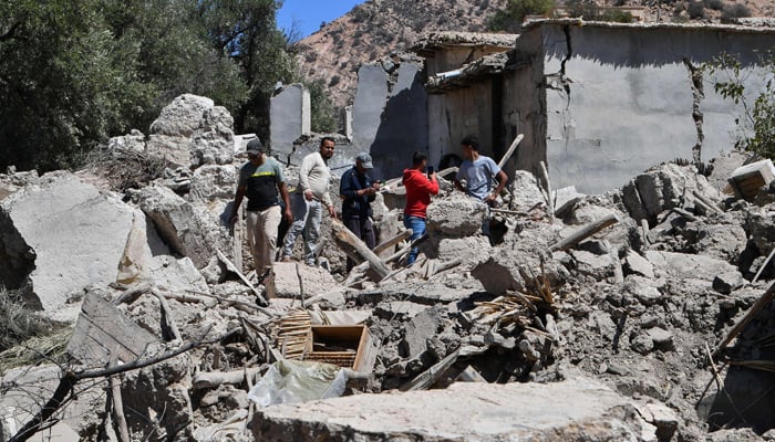 Residents search through the rubble of their homes in Imoulas village of the Taroudant province, one of the most devastated in quake-hit Morocco, on September 11, 2023. — AFP