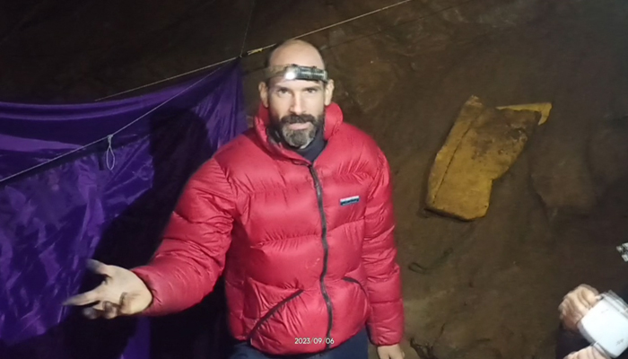 This video grab taken on September 8, 2023, shows US caver Mark Dickey as he speaks to the camera while standing at a camp in the Morca Cave of the Taurus Mountains in southern Turkey. — AFP
