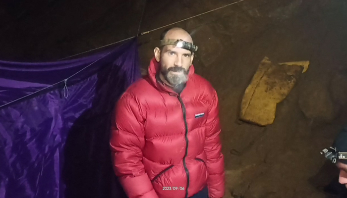 This video grab taken on September 8, 2023, shows US caver Mark Dickey as he speaks to the camera while standing at a camp in the Morca Cave of the Taurus Mountains in southern Turkey. — AFP