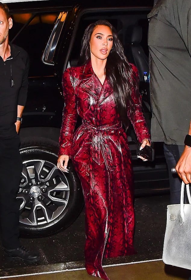 Kim Kardashian drops jaws in sizzling snakeskin trench while out for dinner with Jeff Bezos fiancée