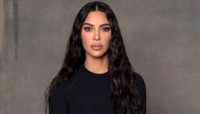 Kim Kardashian drops jaws in sizzling snakeskin trench while out for dinner with Jeff Bezos fiancée