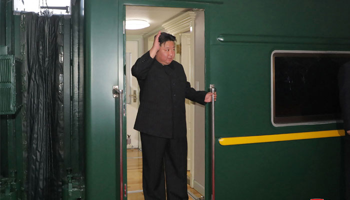 North Koreas leader Kim Jong Un (C) waves as he departs by train from Pyongyang for a visit to Russia on September 10, 2023. — AFP