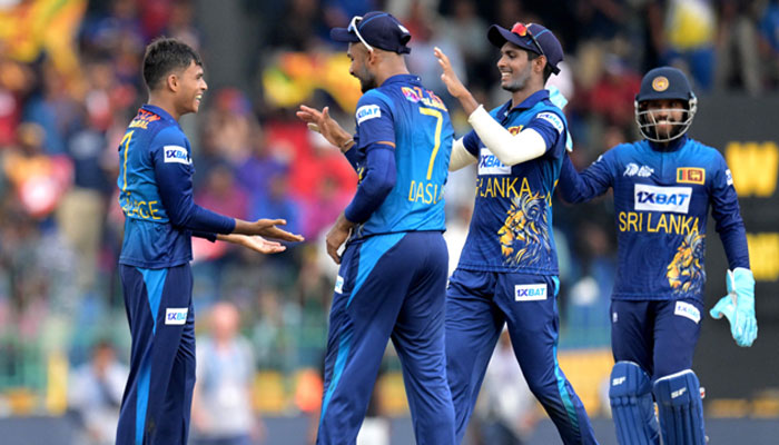 Sri Lanka´s Dunith Wellalage (L) celebrates with teammates after taking the wicket of India´s KL Rahul (not pictured) during the Asia Cup 2023 Super Four ODI cricket match between India and Sri Lanka at the R. Premadasa Stadium in Colombo on September 12, 2023. — AFP