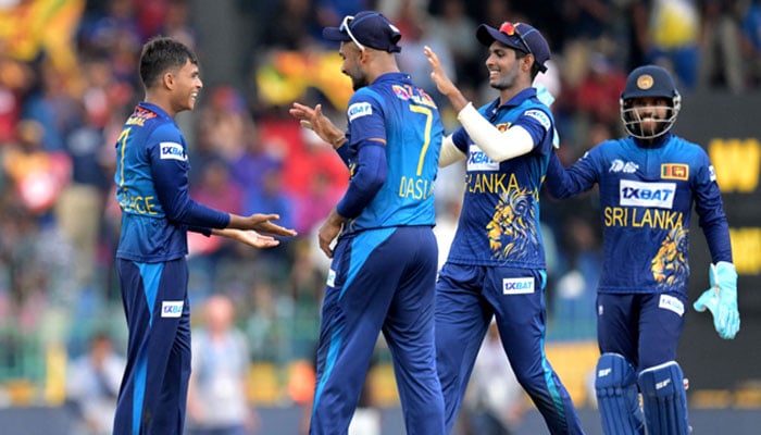 Sri Lanka´s Dunith Wellalage (L) celebrates with teammates after taking the wicket of India´s KL Rahul (not pictured) during the Asia Cup 2023 Super Four ODI cricket match between India and Sri Lanka at the R. Premadasa Stadium in Colombo on September 12, 2023. — AFP
