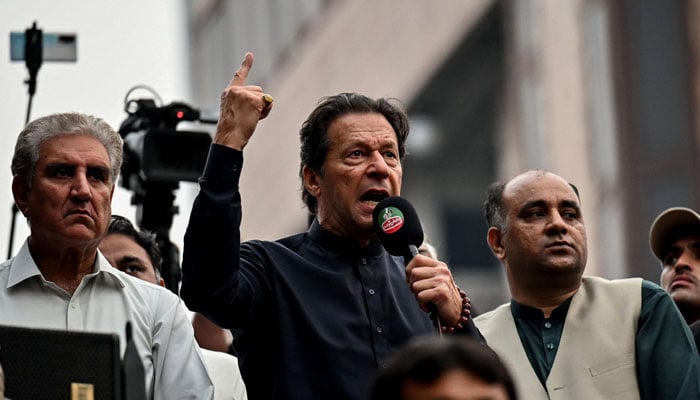 PTI Chairman Imran Khan addressing a public gathering in this undated picture. — AFP