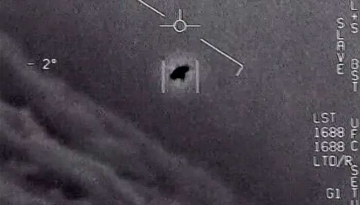 In the image from a video provided by the Department of Defence labelled Gimbal, from 2015, an unexplained object is seen at the centre as it is tracked and soars high along the clouds, travelling against the wind.— US Defence Department