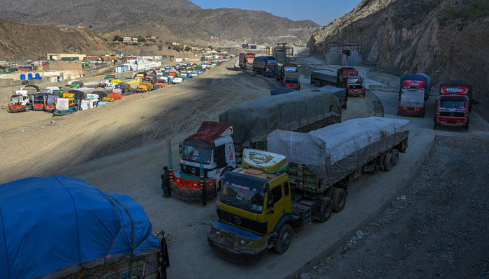 In this picture taken on on September 11, 2023, trucks are seen parked along a road and a parking area near the Pakistan-Afghanistan border in Torkham, after the Torkham border closed on September 6, 2023, following clashes between border forces of both countries. — AFP
