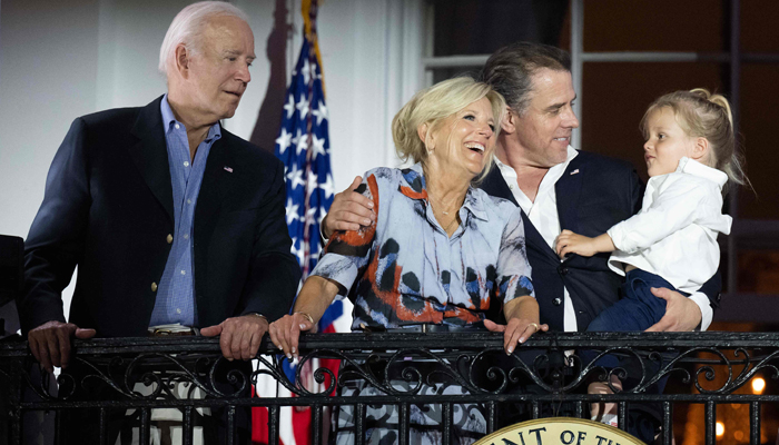 US President Joe Biden, First Lady Jill Biden and Hunter Biden with his son Beau watch the Independence Day fireworks display from the Truman Balcony of the White House on July 4, 2023. — AFP