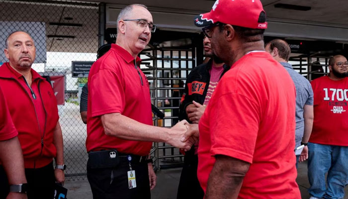 United Auto Workers President Shawn Fain greets UAW autoworkers, at the Stellantis Sterling Heights Assembly Plant, to mark the beginning of contract negotiations in Sterling Heights, Michigan, July 12, 2023. REUTERS