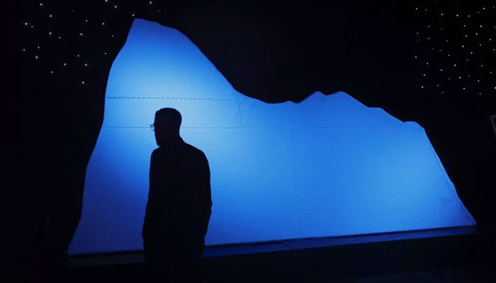 A visitor walks past a replica of an iceberg on the opening day of the XXL Titanic exhibition at Paris Expo Porte de Versailles in Paris on July 18, 2023. — AFP/File