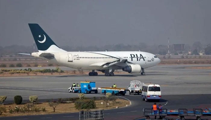 A Pakistan International Airlines (PIA) plane prepares to take off at Alama Iqbal International Airport in Lahore on February 1, 2012. — Reuters