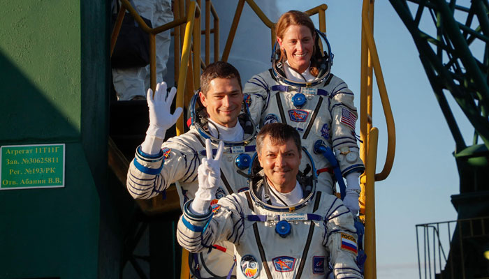 (bottom-top) Russian Roscosmos cosmonauts Oleg Kononenko and Nikolai Chub and US Nasa astronaut Loral OHara, members of the ISS Expedition 70-71 main crew, board the Soyuz MS-24 spacecraft ahead of the launch in the Russian leased Baikonur cosmodrome in Kazakhstan on September 15, 2023. — AFP