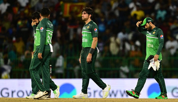 Pakistan´s captain Babar Azam (L) with teammates walks back to the pavilion after Sri Lanka won by 2 wickets during the Asia Cup 2023 Super Four one-day international (ODI) cricket match between Sri Lanka and Pakistan at the R. Premadasa Stadium in Colombo early September 15, 2023. — AFP