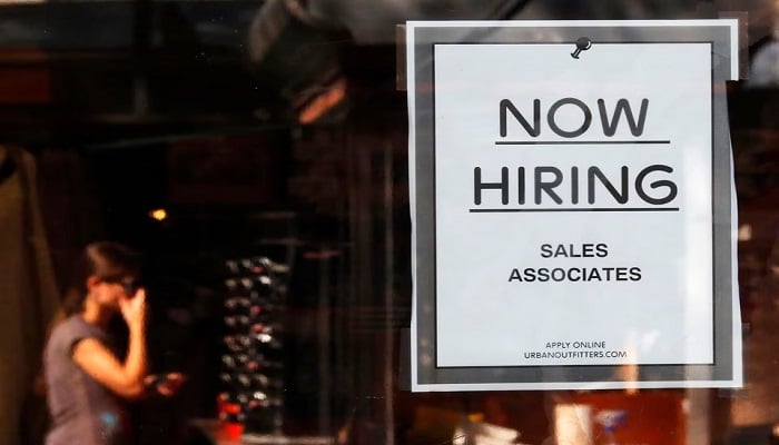 A Now Hiring sign hangs on the door to the Urban Outfitters store at Quincy Market in Boston, Massachusetts September 5, 2014. —Reuters/File